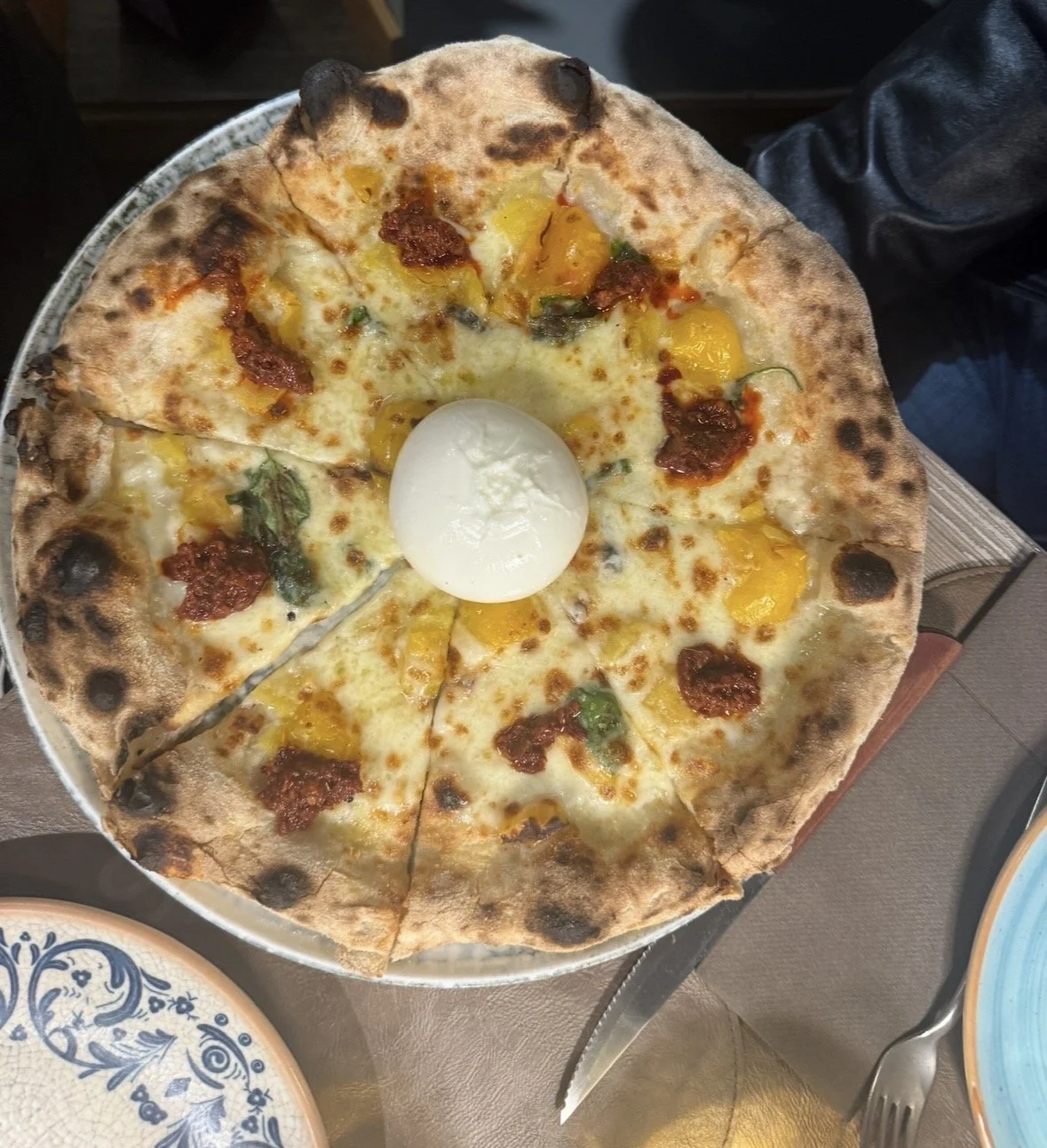 Burrata pizza with tomatoes and basil at Santarpia Florence