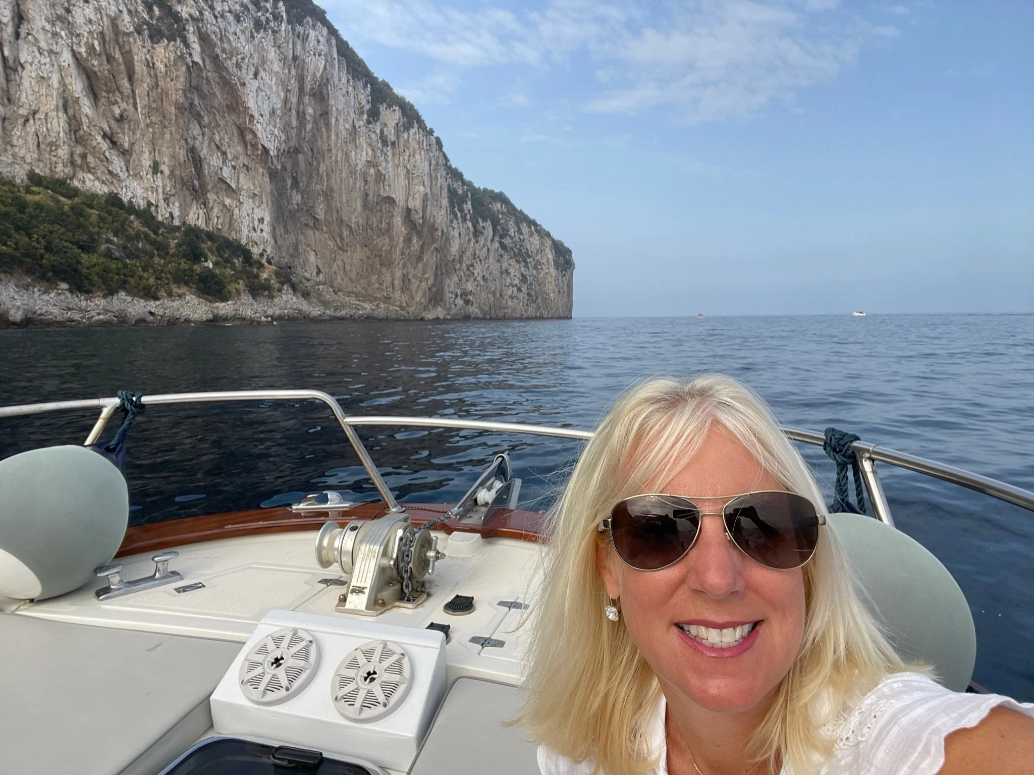 Boat tour along the dramatic limestone cliffs of Capri, italy