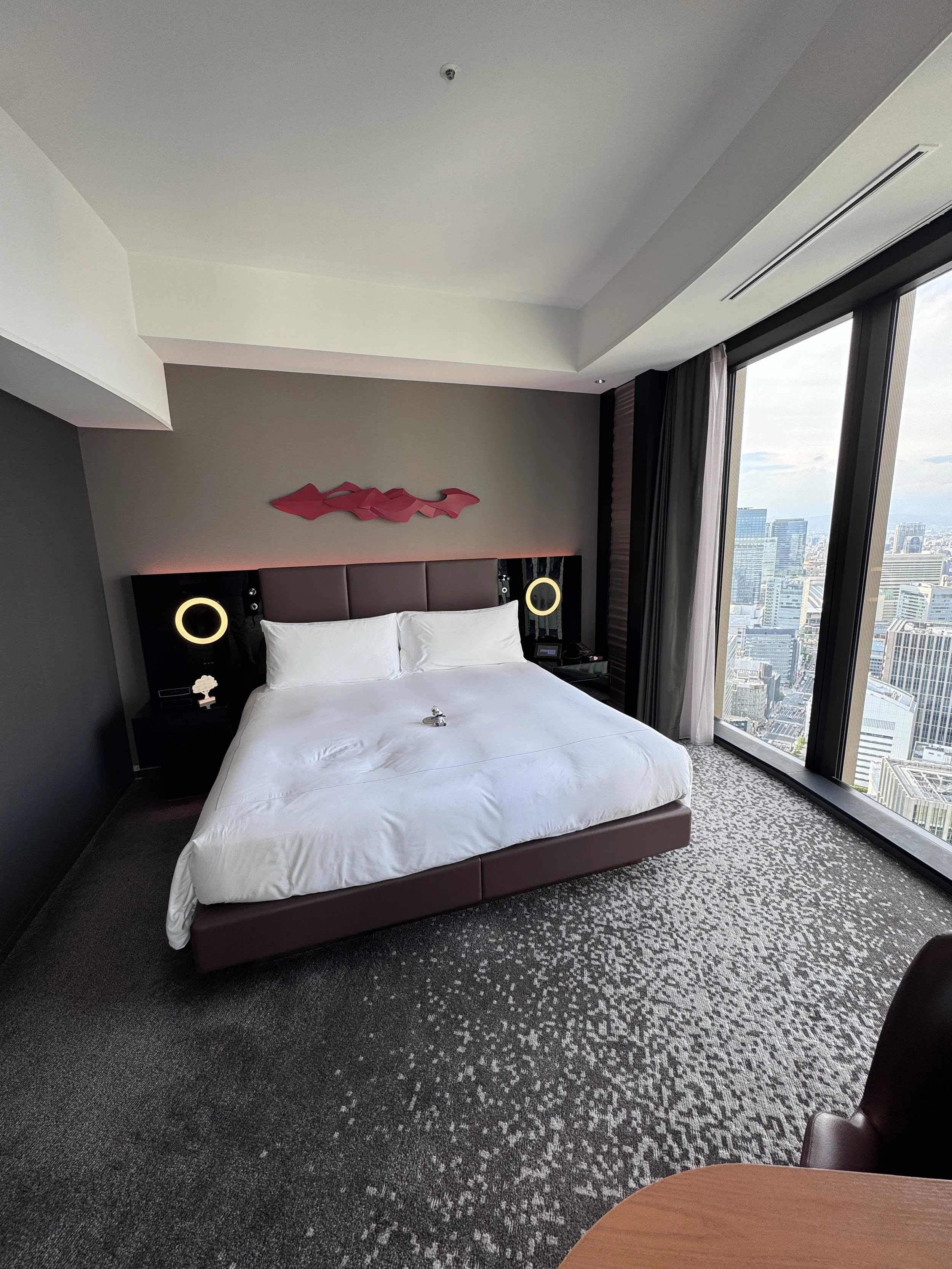King guest room at Conrad Osaka with floor-to-ceiling city views