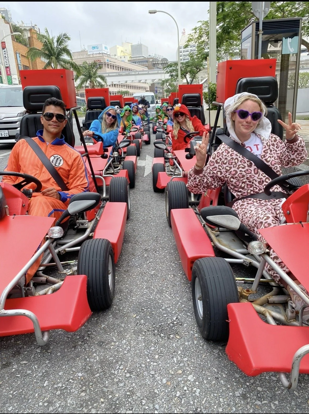 Travelers participating in a street kart tour in Naha Okinawa