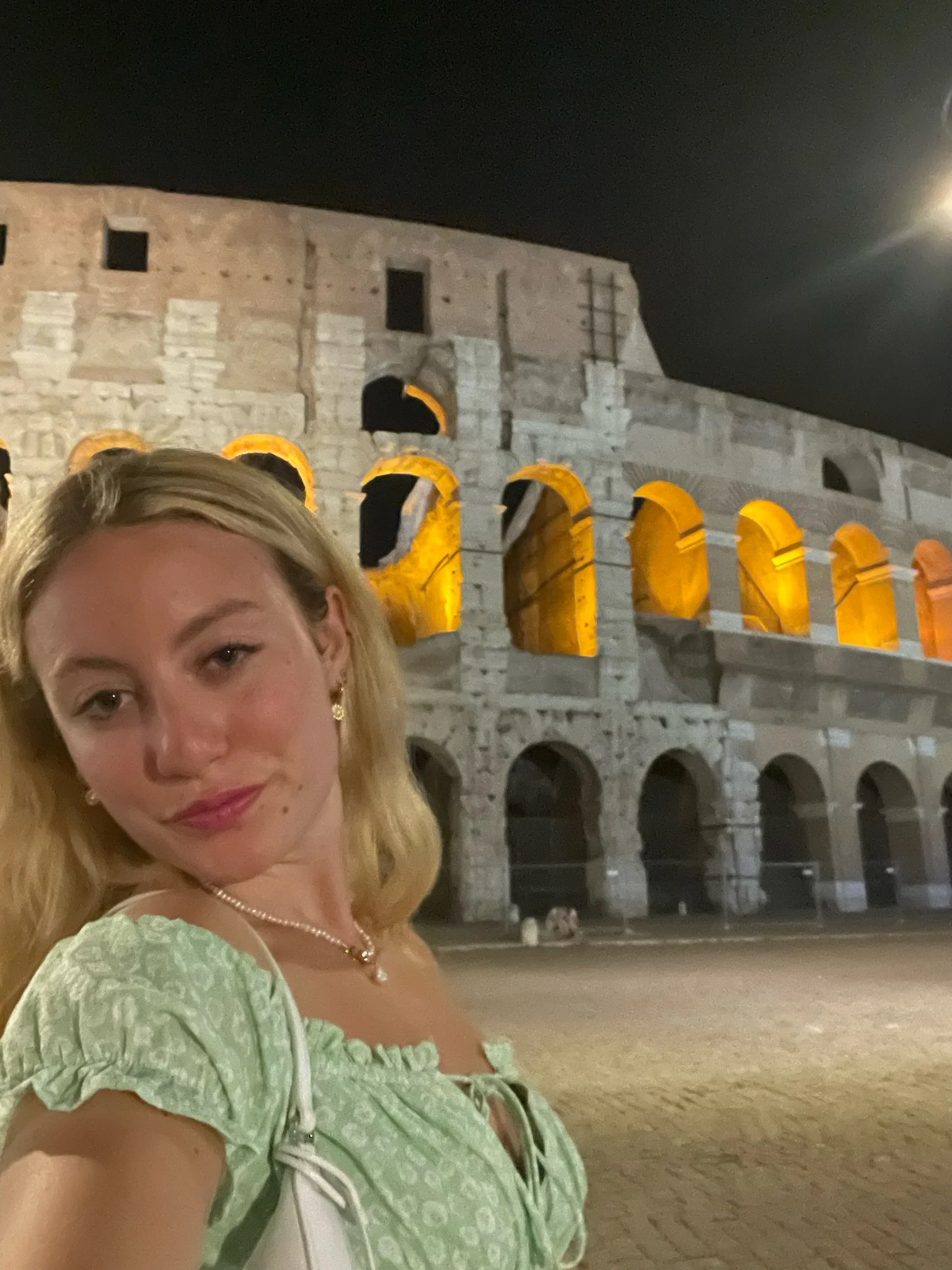 The illuminated Colosseum at night in Rome