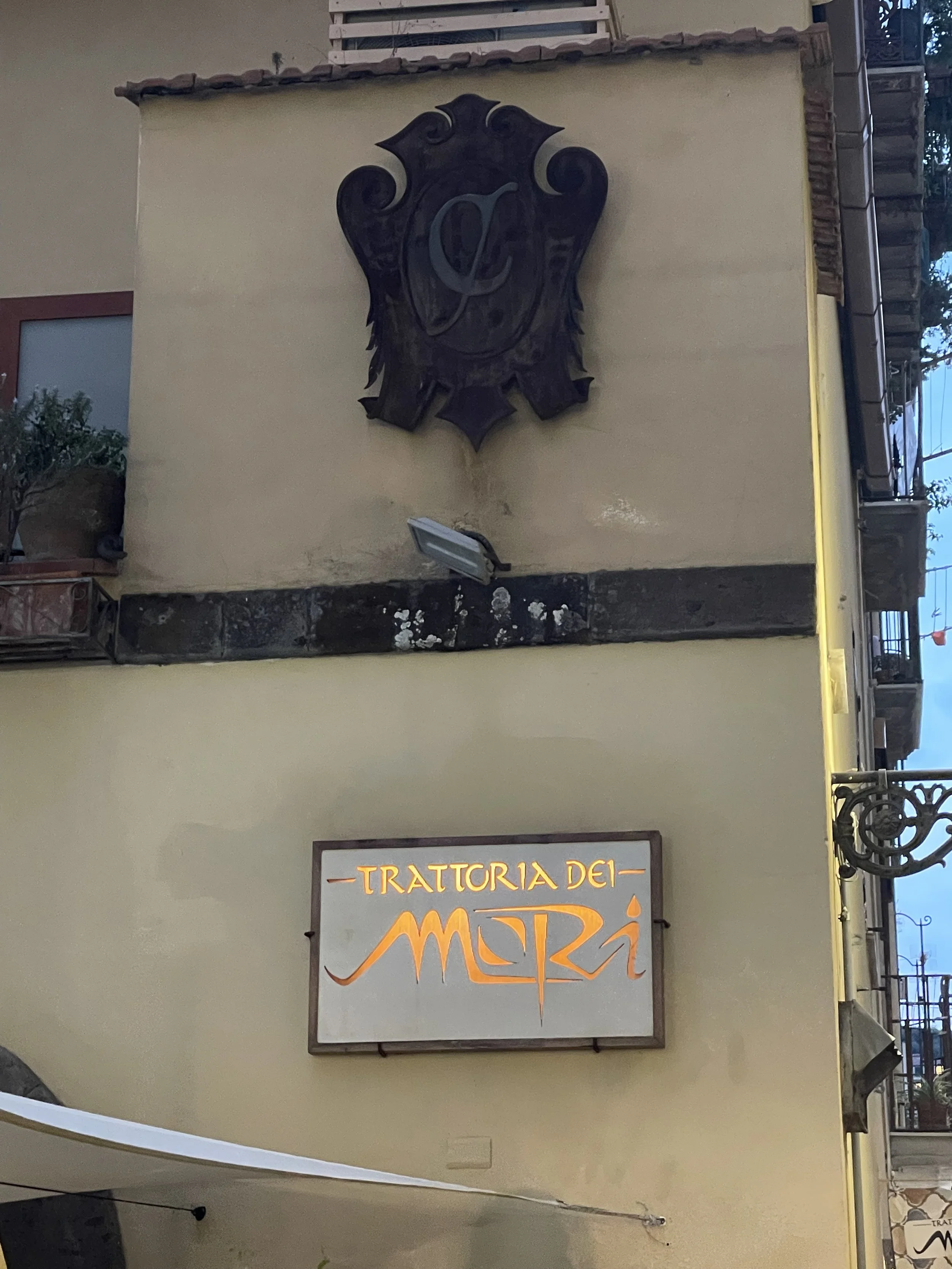 Exterior entrance to Trattoria dei Mori seafood restaurant in Sorrento, Italy
