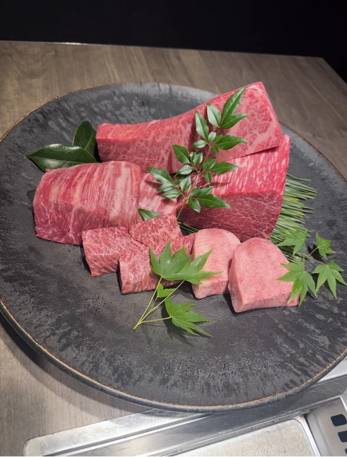 A5 Japanese wagyu assortment at Ushigoro S. Ginza, showcasing premium cuts of marbled beef in Tokyo.