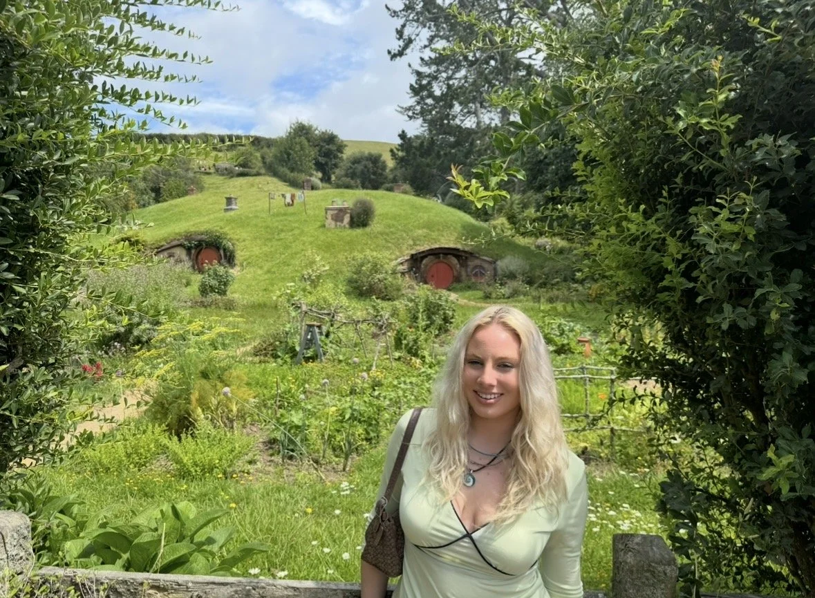 View of Hobbiton hillside and hobbit holes in New Zealand