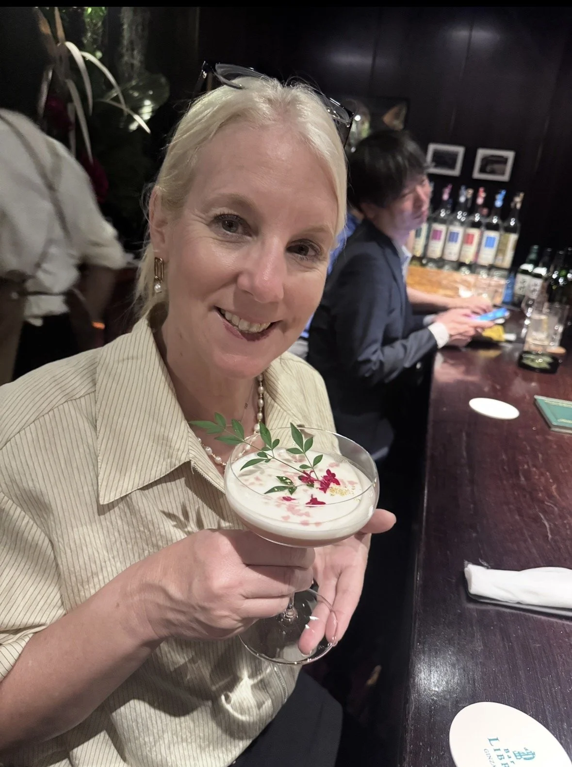 Guest enjoying a floral cocktail at Bar Libre Ginza in Tokyo