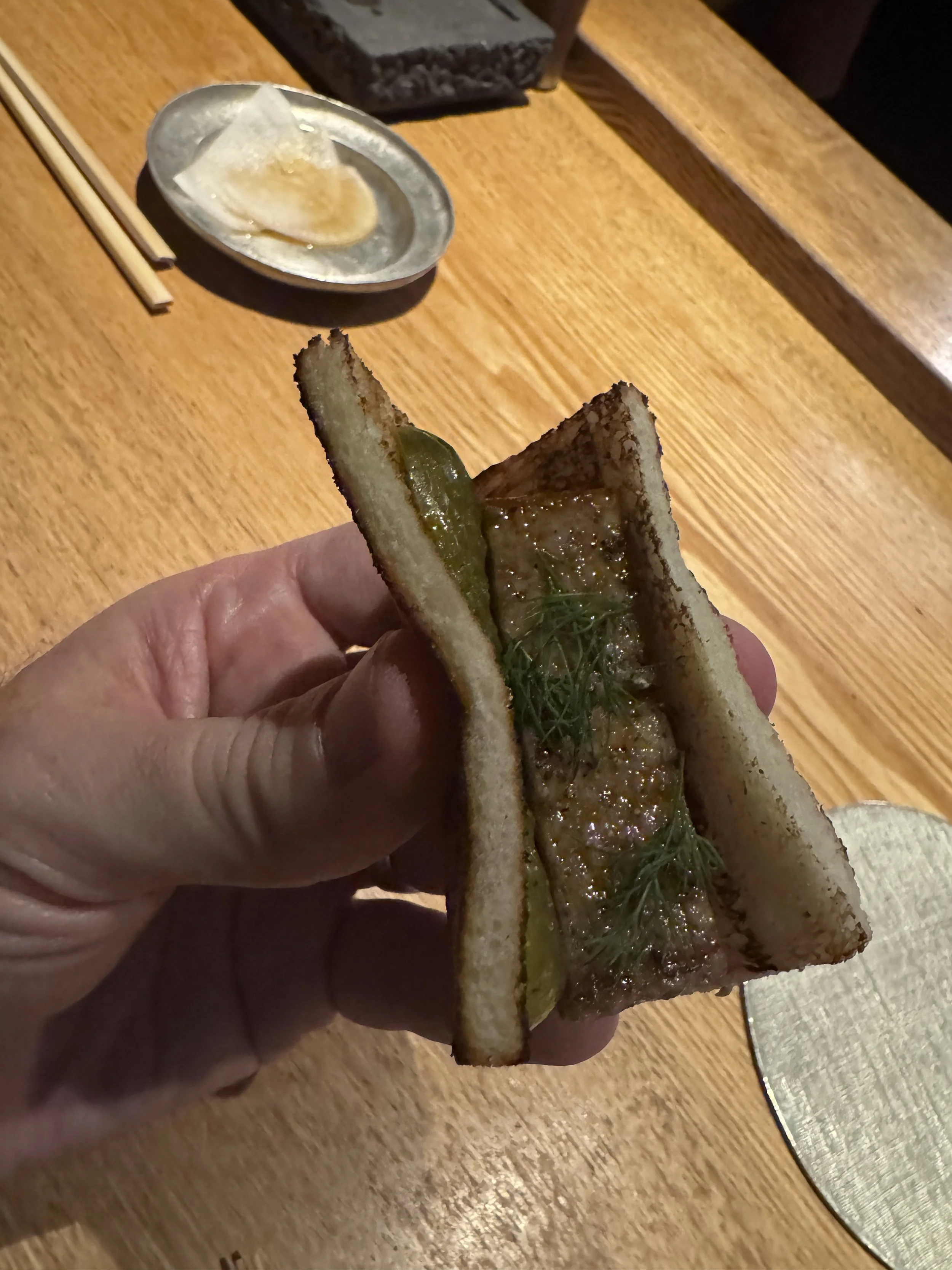 Signature grilled chicken sandwich served at Yakitori Ichimatsu in Osaka.