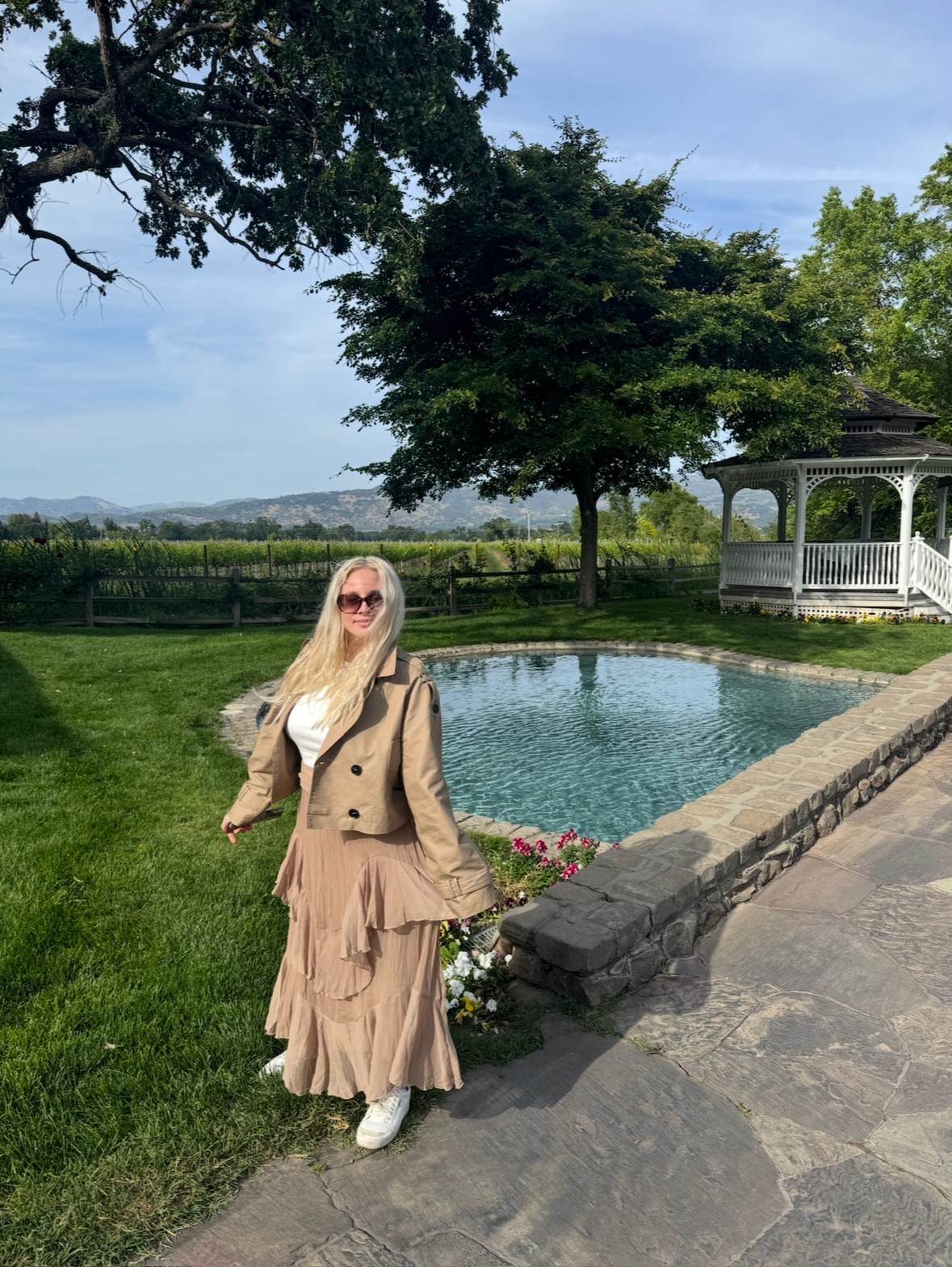 Visitor beside the pond and gazebo at Far Niente winery
