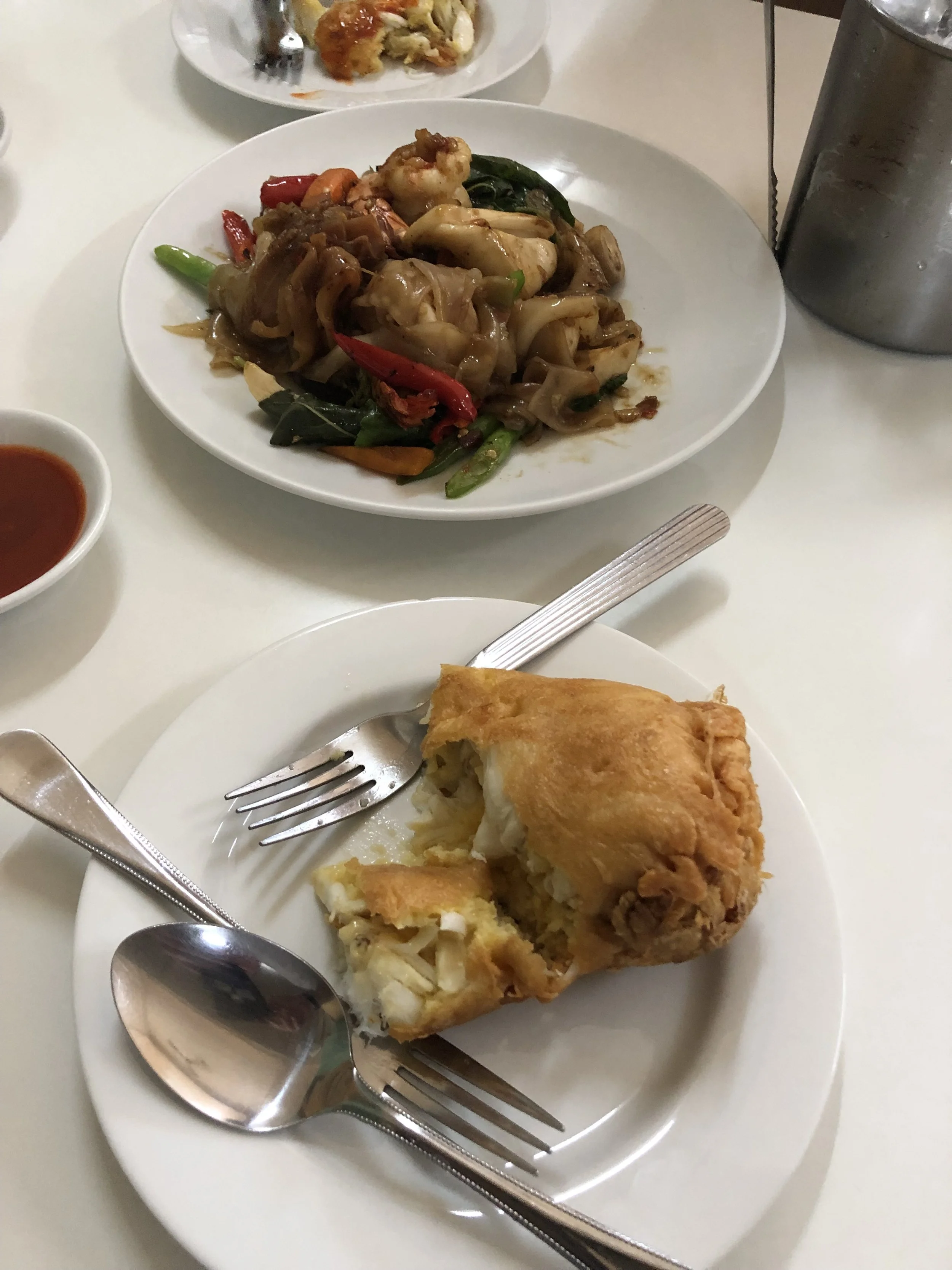 Crab omelet and stir-fried noodles at Jay Fai in Bangkok