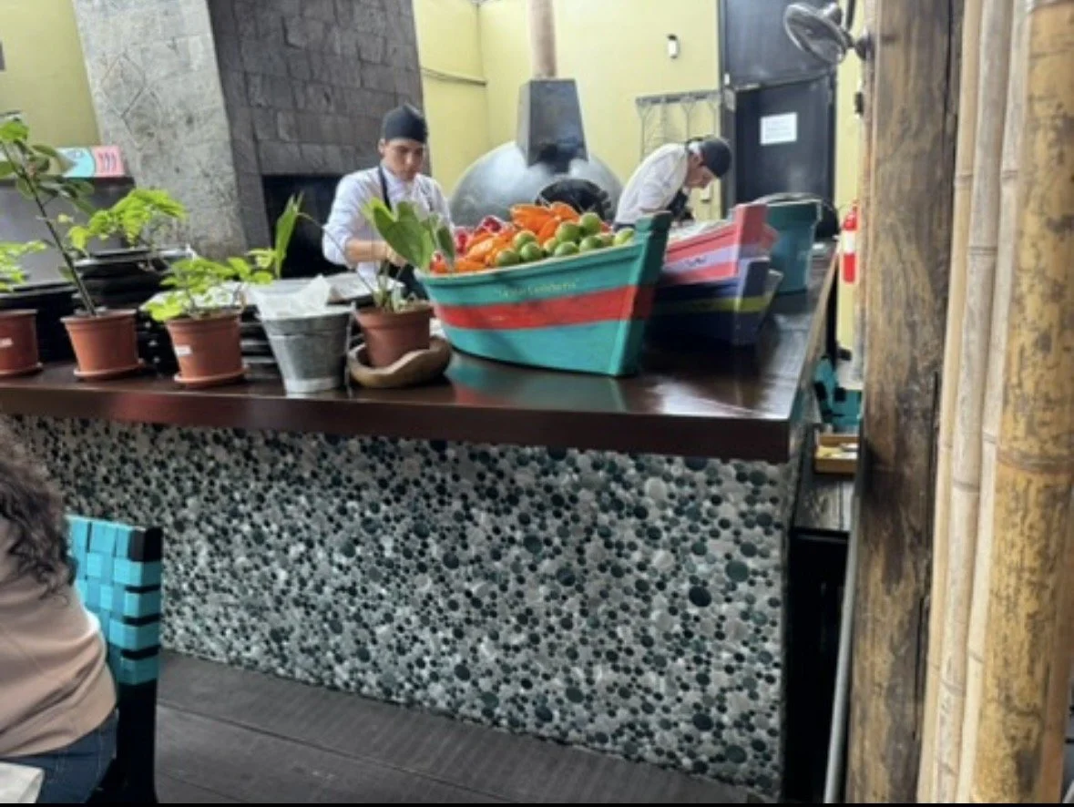 Open kitchen and fresh seafood preparation at La Mar Lima