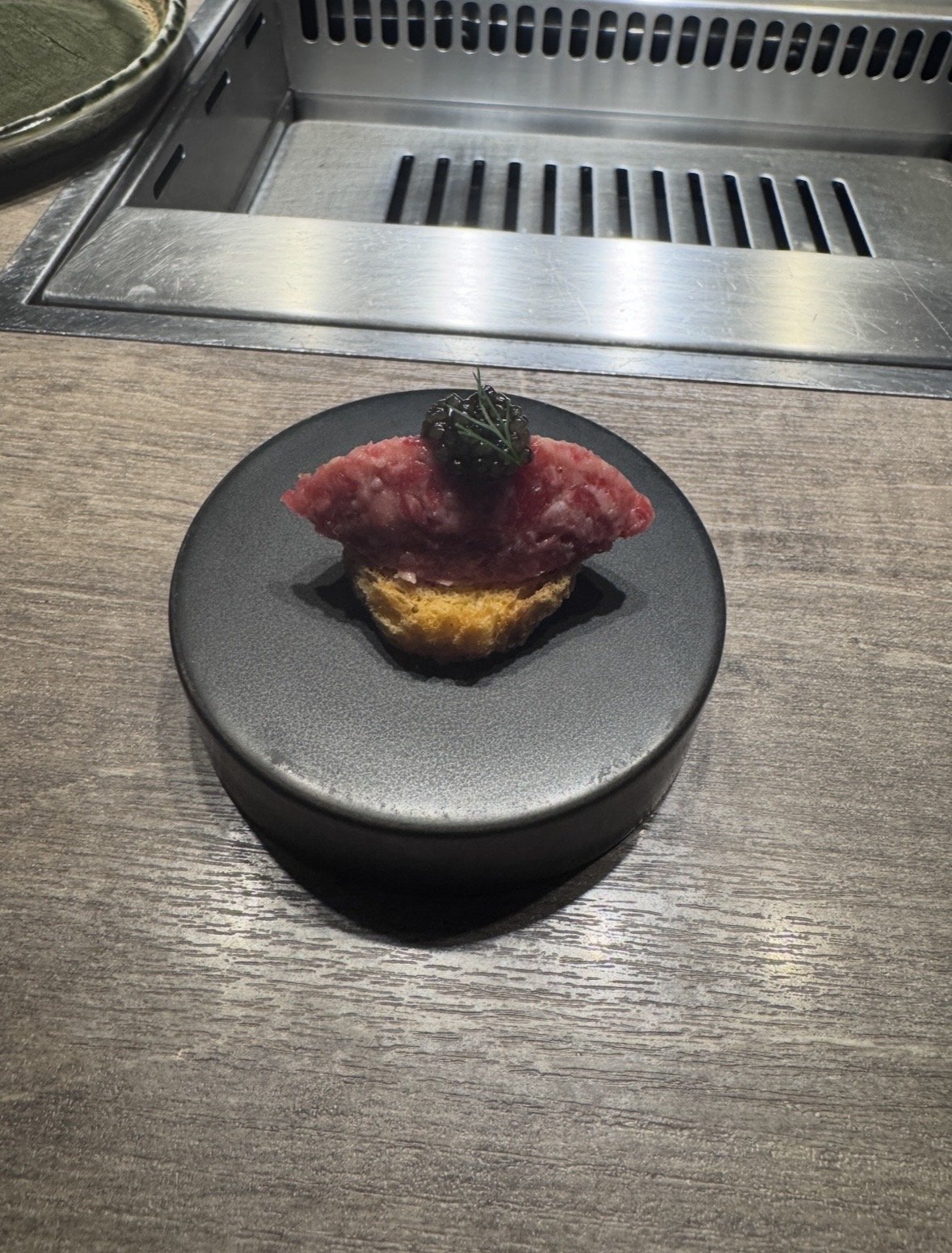 Luxury wagyu canapé topped with caviar at Ushigoro S. Ginza, Tokyo.
