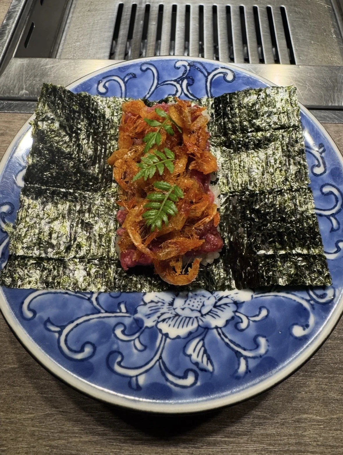 Signature wagyu tartare served with crispy nori at Ushigoro S. Ginza in Tokyo.