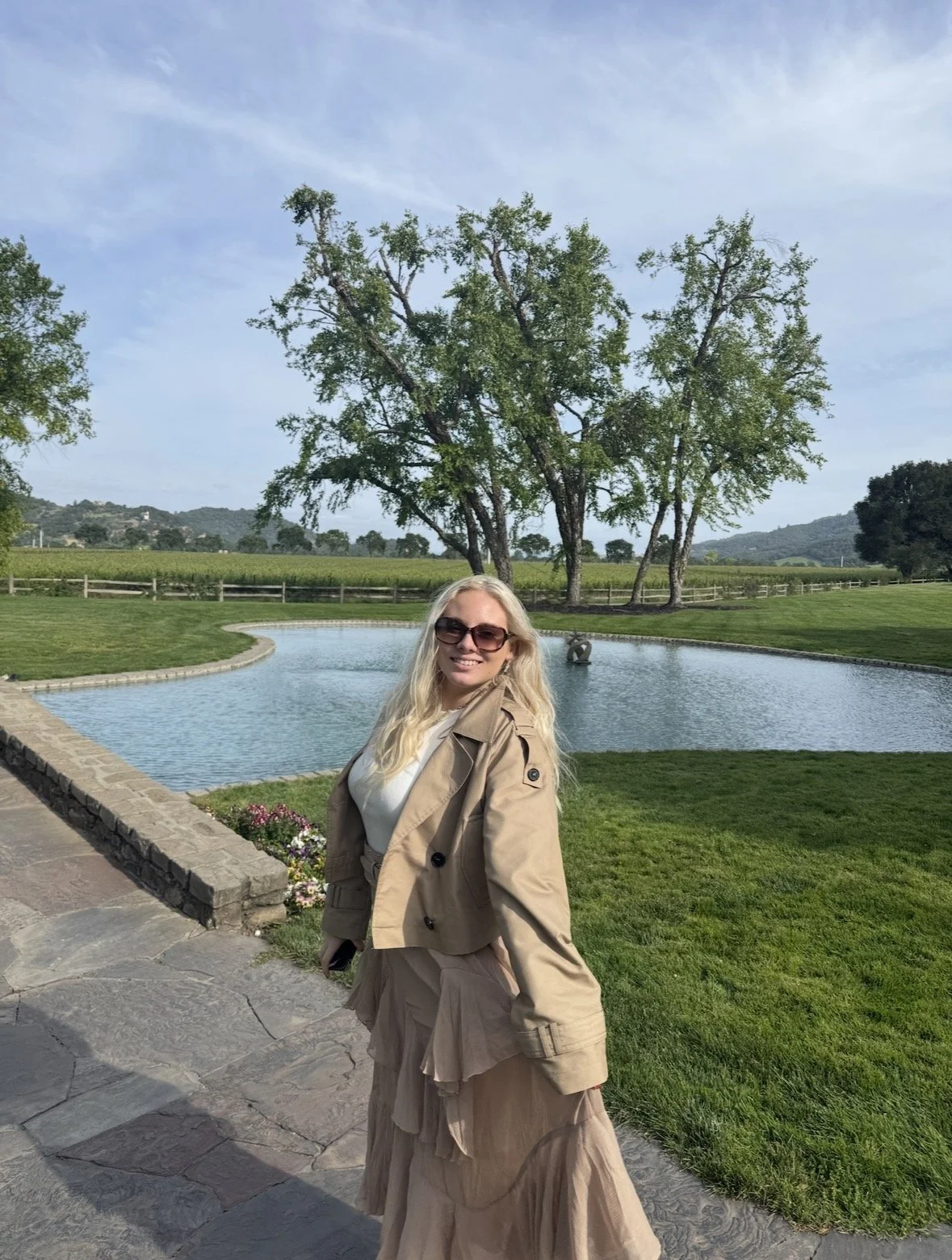 Visitor exploring the landscaped grounds at Far Niente in Napa Valley