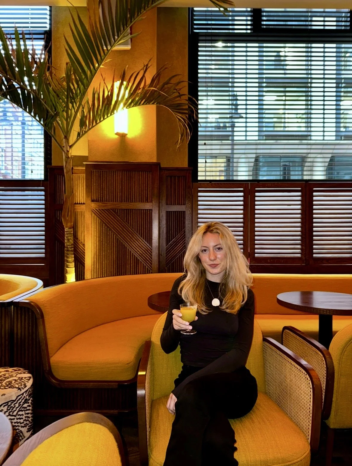 Cocktail at Kwant in Mayfair, London, with elegant lounge seating
