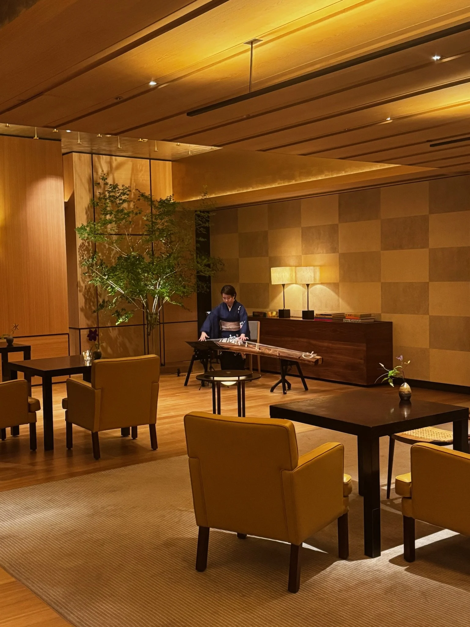 Park Hyatt Kyoto lobby lounge featuring contemporary Japanese design and a live koto performance