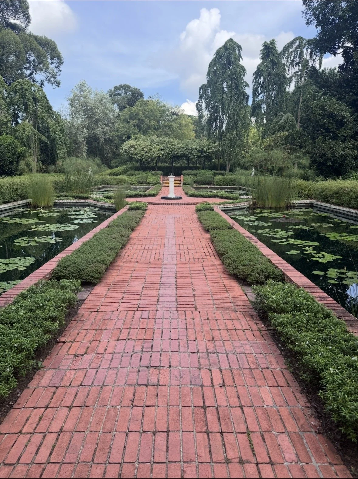 Brick pathway through the Water Garden at Singapore Botanic Gardens