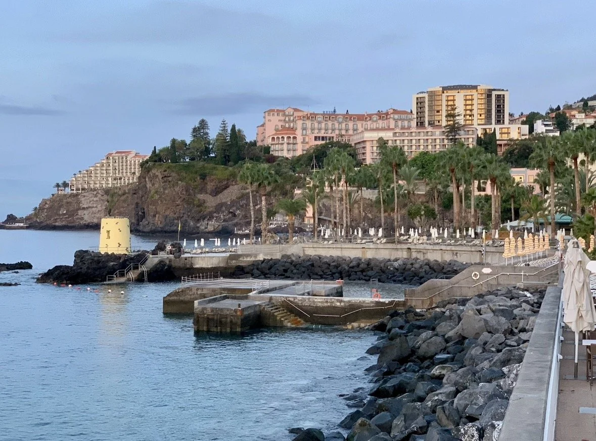 Waterfront promenade and harbor in Funchal, Madeira at sunset