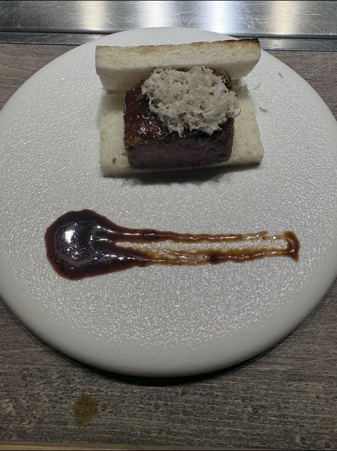 Signature A5 wagyu steak sandwich served during the tasting menu at Ushigoro S. Ginza.