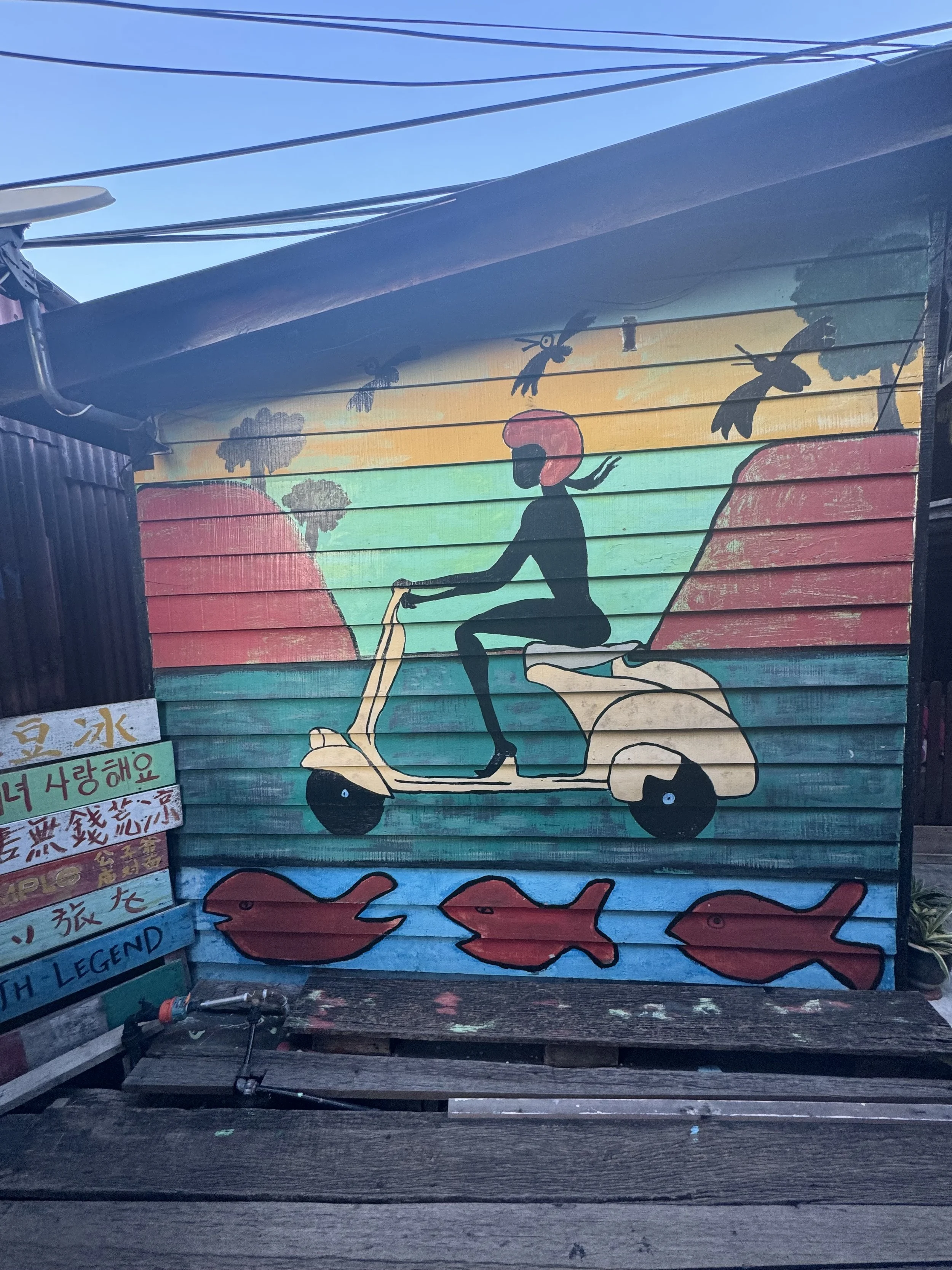 Colorful scooter street art mural in George Town Penang