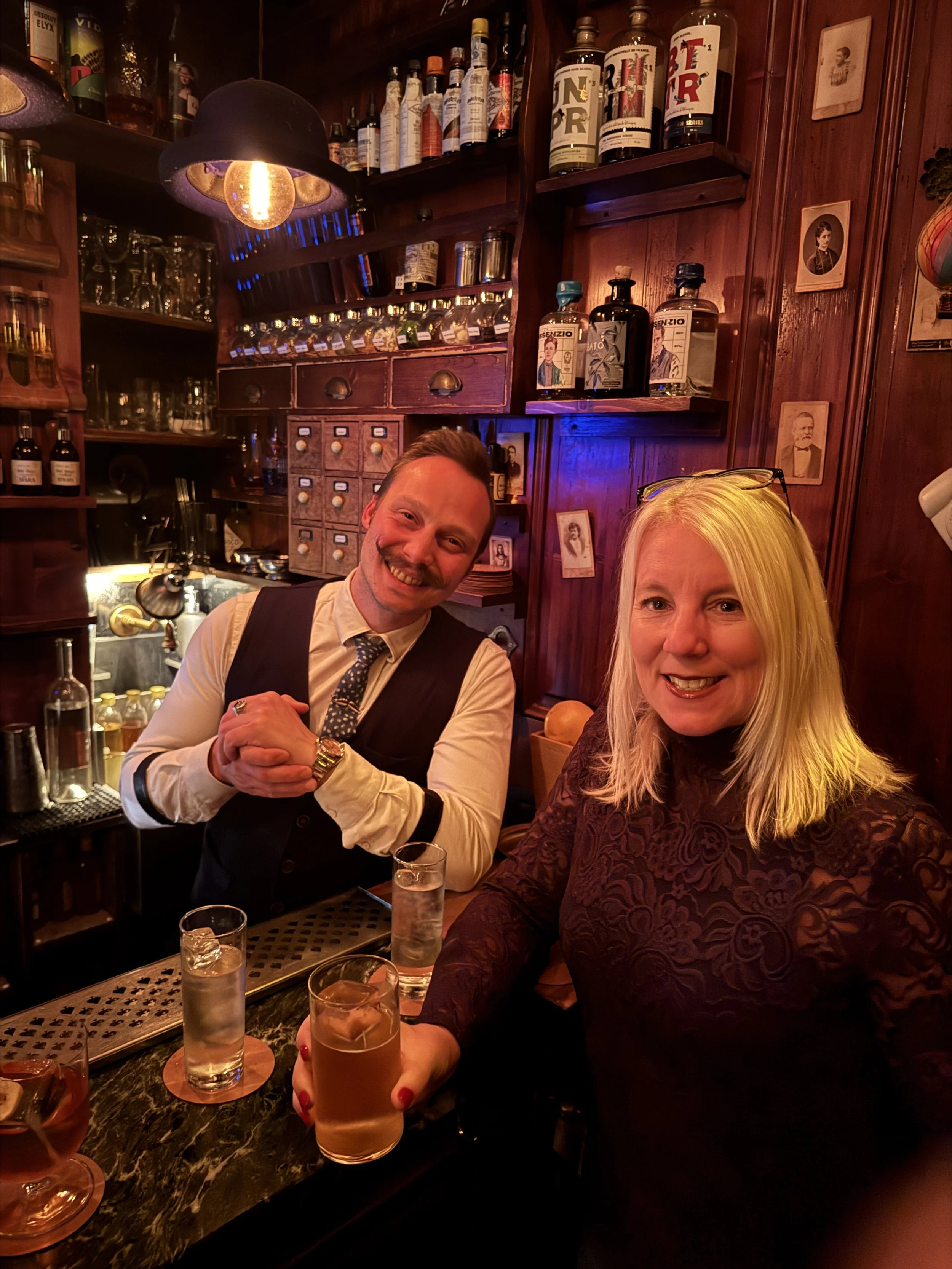 Bartender and guests inside Backdoor 43 in Milan