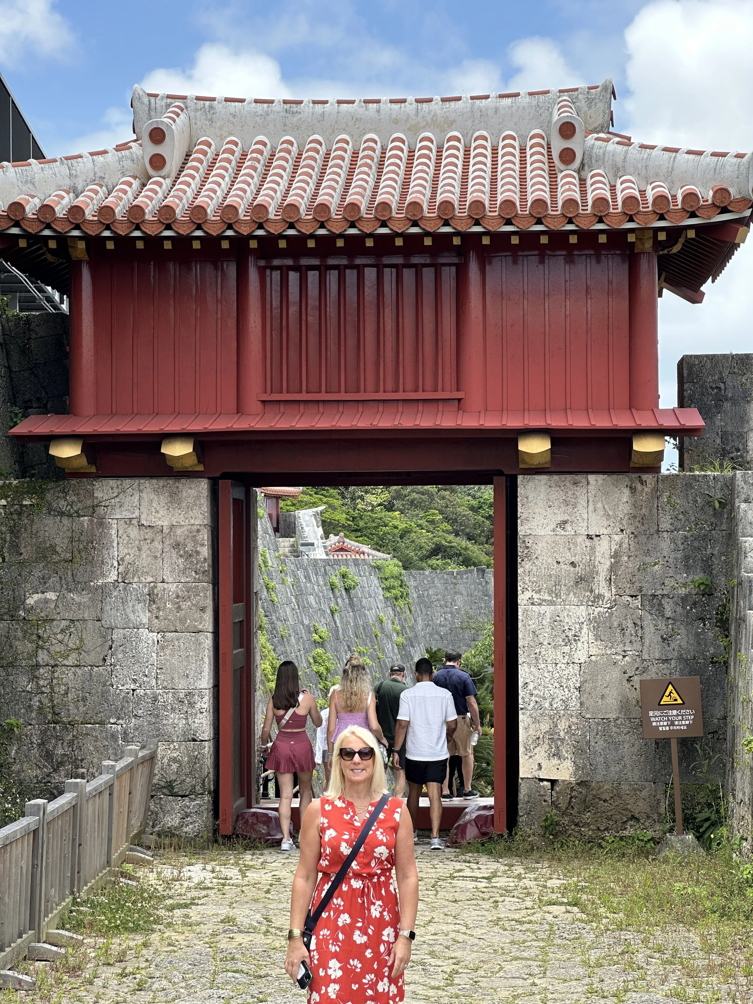 Visitors entering Shuri Castle grounds in Okinawa