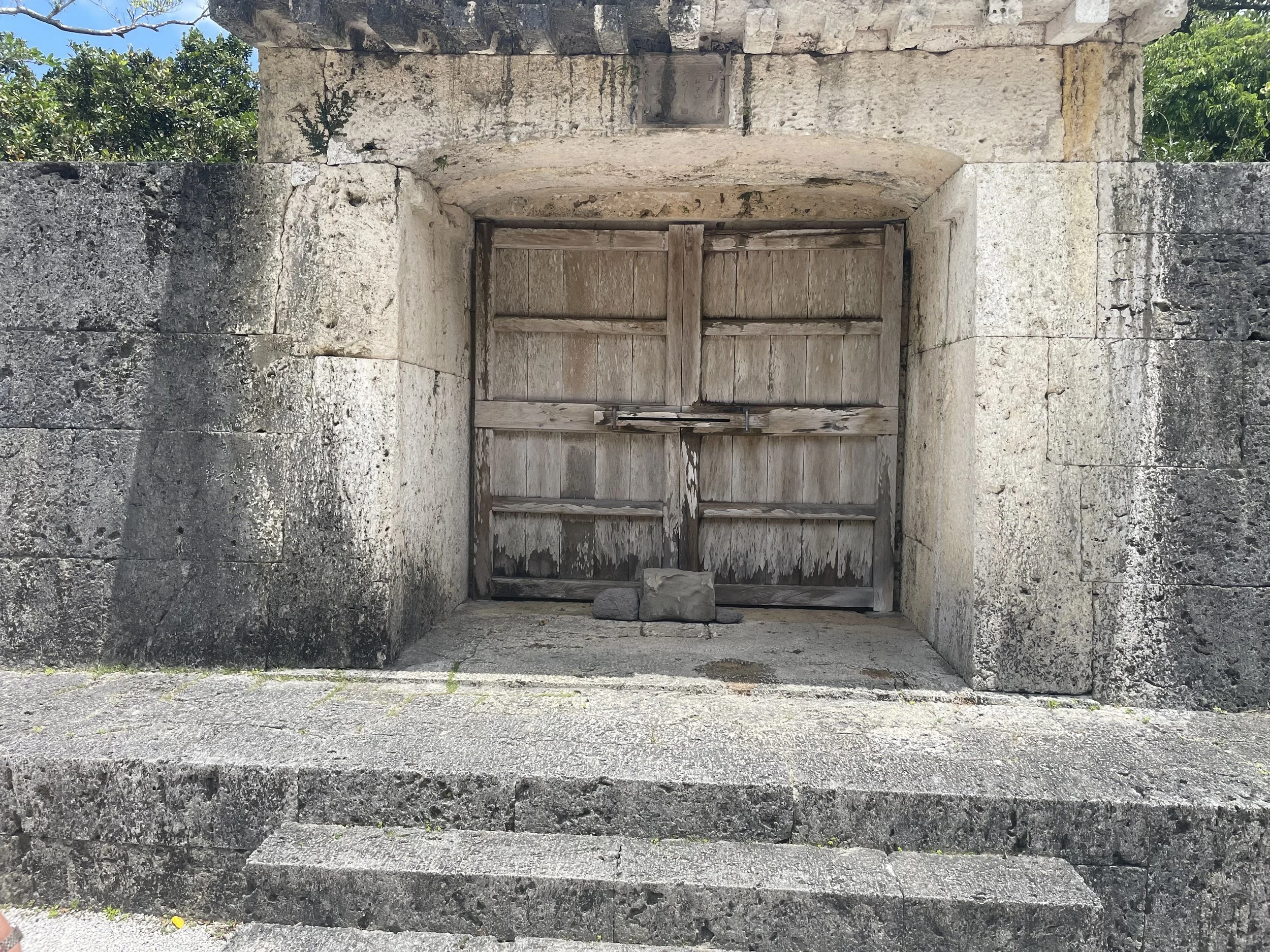 Traditional stone gate within Shuri Castle grounds