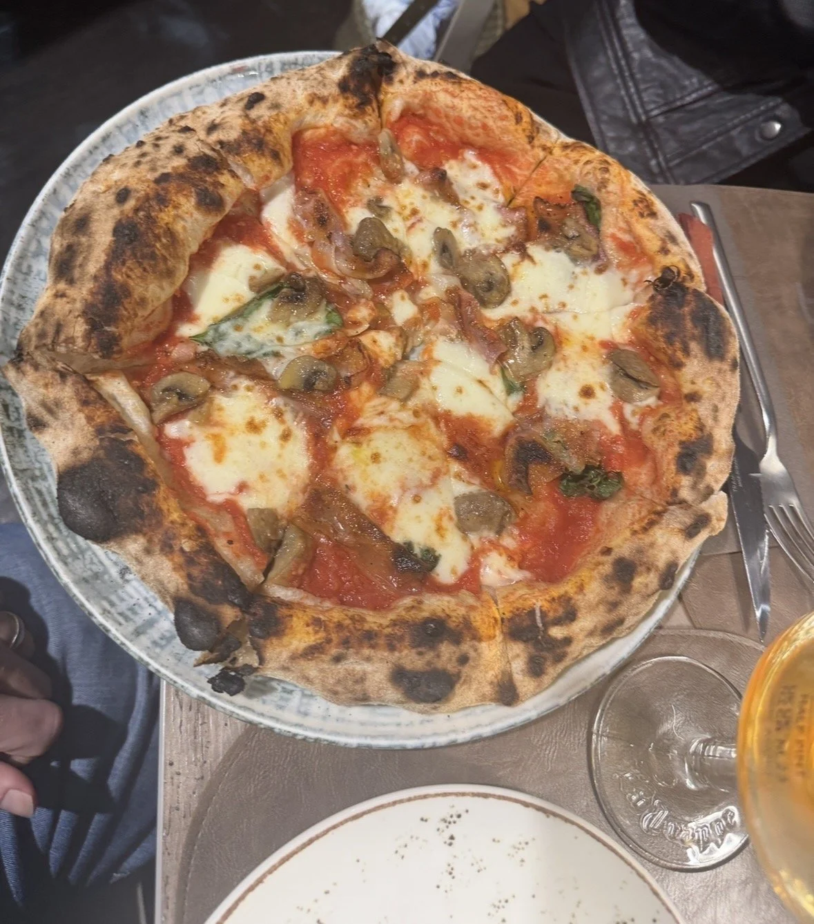 Neapolitan style pizza with melted cheese and tomato sauce at Giovanni Santarpia Florence
