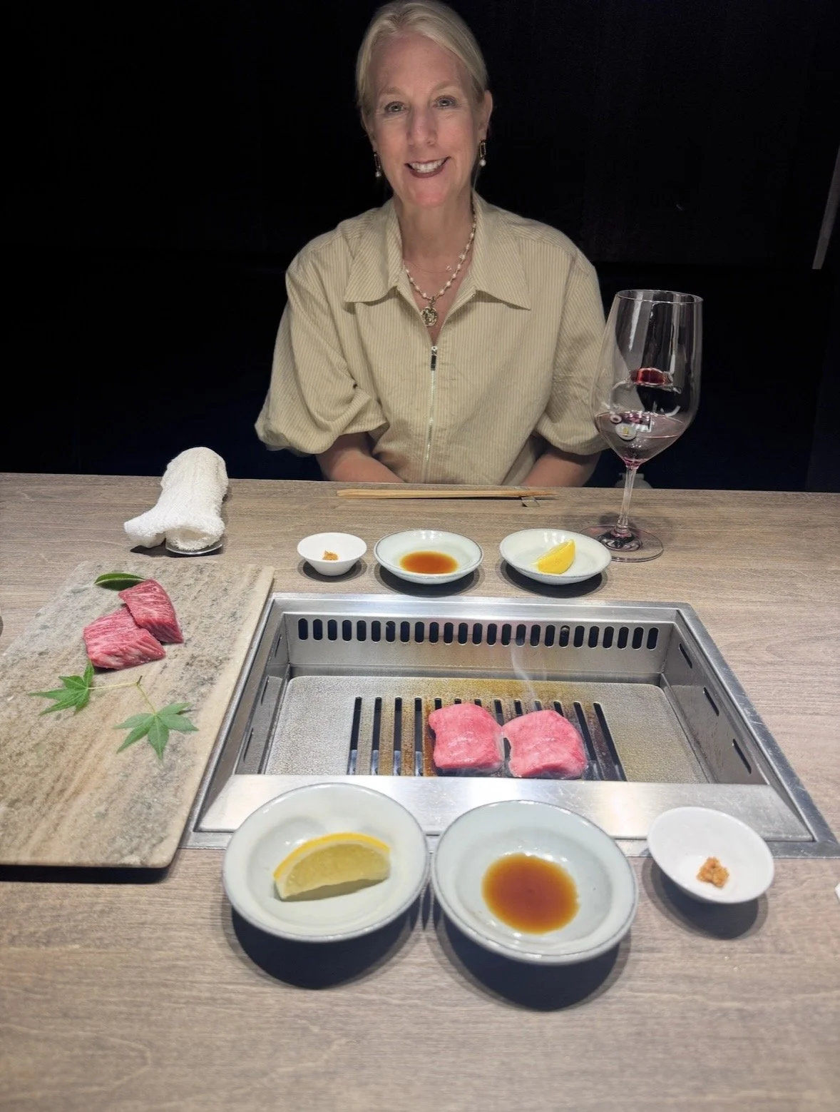 Premium wagyu being grilled tableside during the tasting experience at Ushigoro S. Ginza