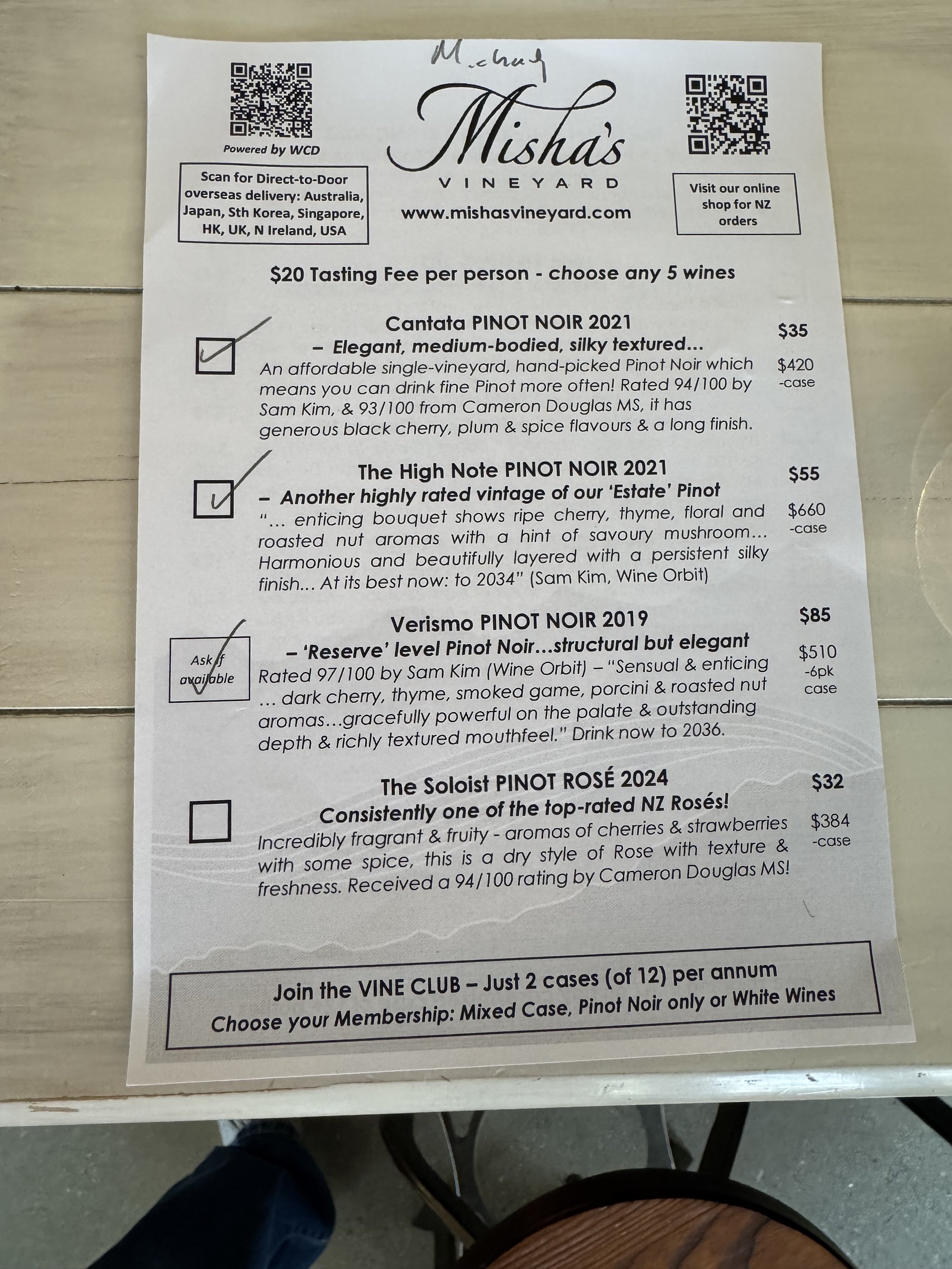 Menu page from Mishas Vineyard featuring wine options including Cantata Pinot Noir 2021, High Note Pinot Noir 2021, Verismo Pinot Noir 2019, and The Soloist Pinot Rosé 2024, with descriptions and prices.