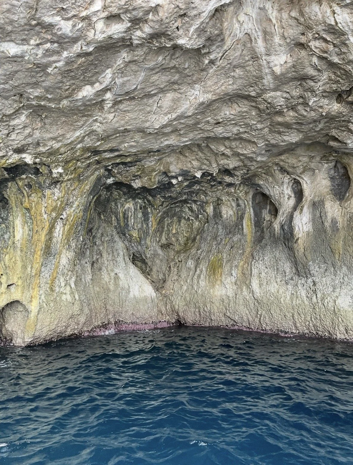 heart inside the grotto sea cave with glowing blue water in Capri