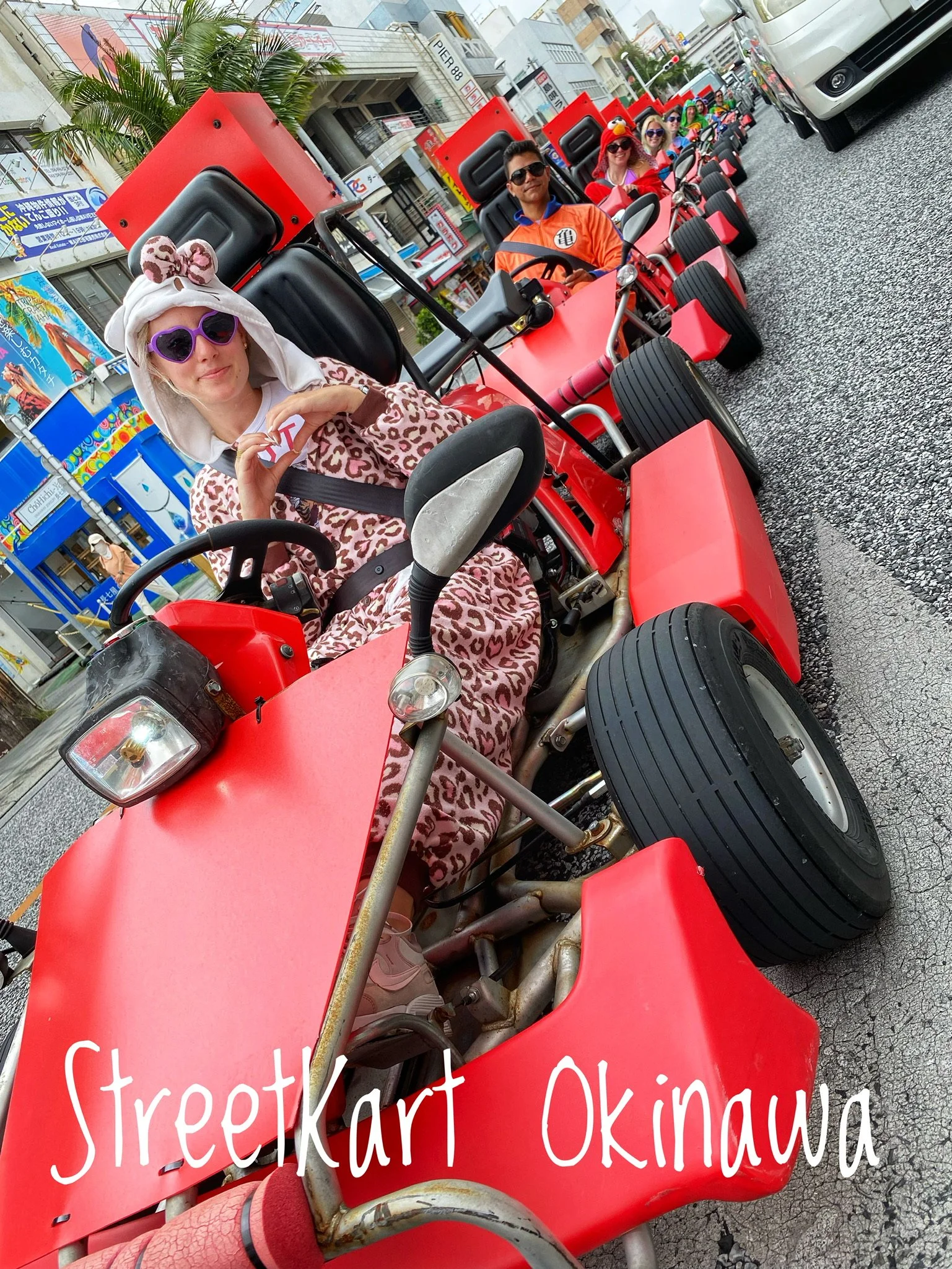 Travelers participating in a street kart tour in Naha Okinawa