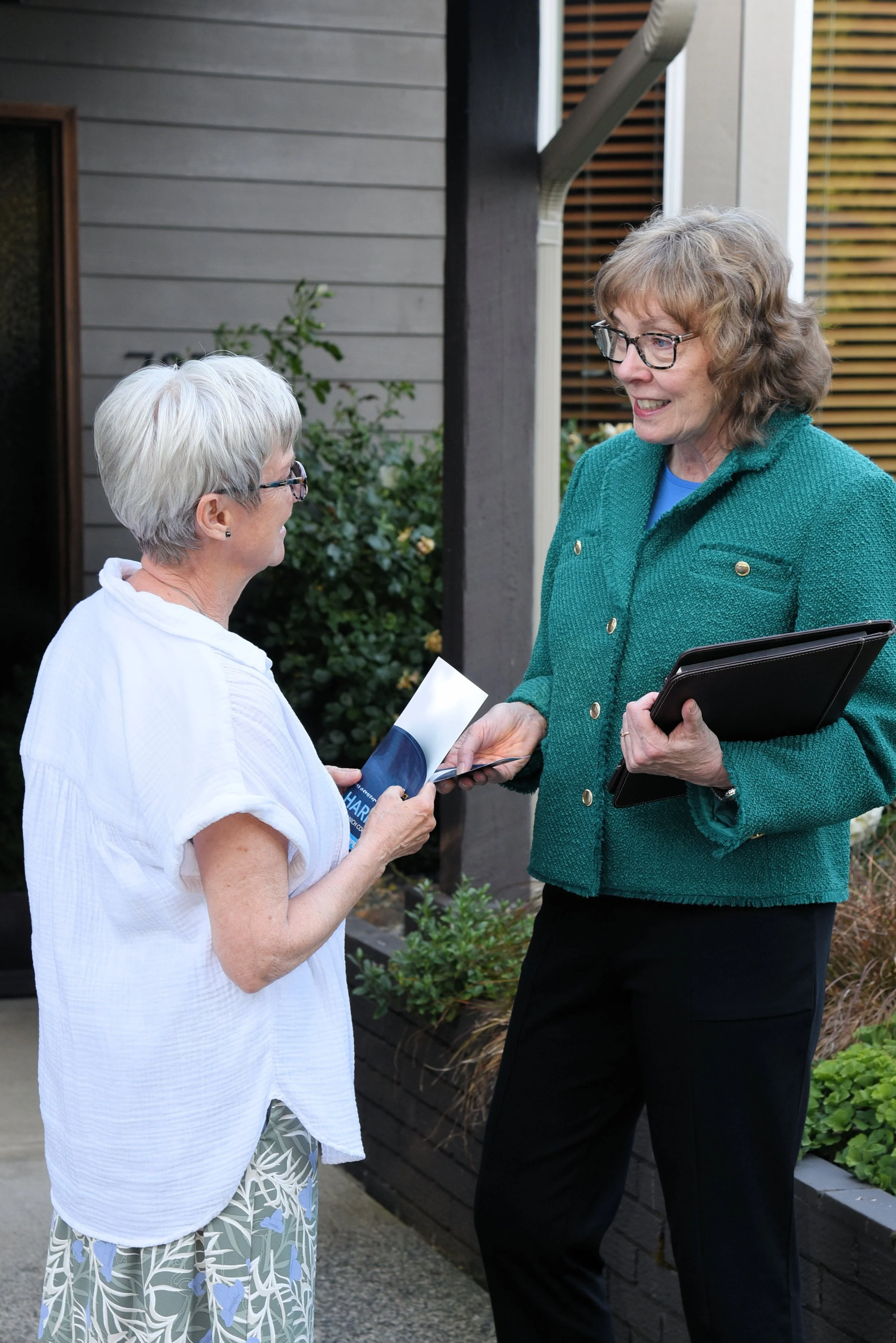 Kathleen speaks with a constituent.