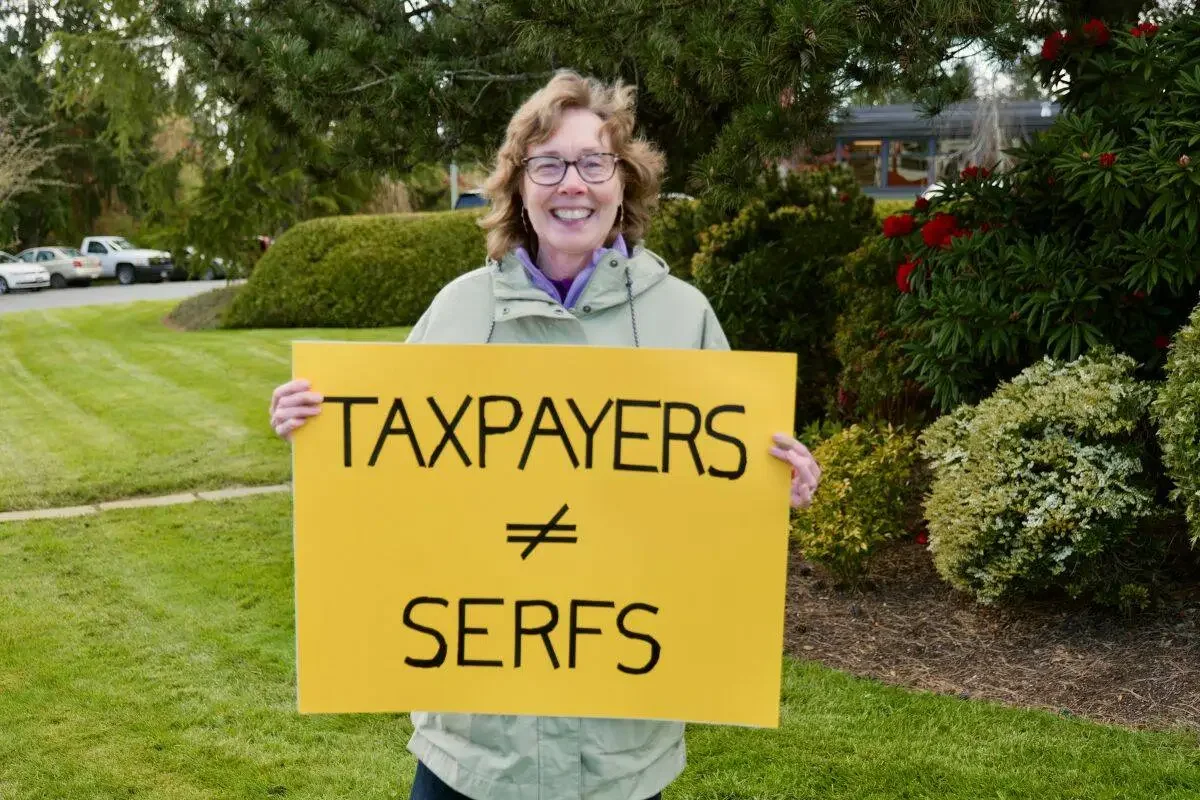 Kathleen at Municipal Hall rally, April 2026