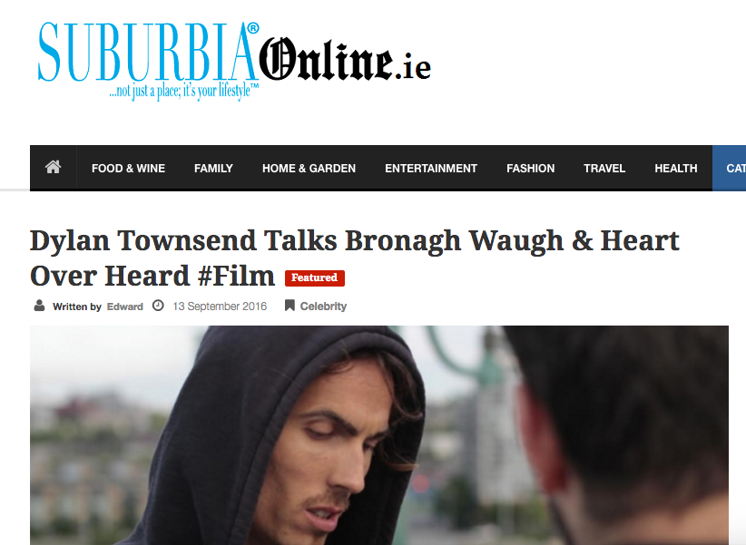 Dylan Townsend  wearing a black hoodie looking down while talking to someone in the background. The webpage header shows the title 'Suburbia Online.ie' and a headline about Dylan Townsend discussing Bronagh Waugh and Heart over a film.