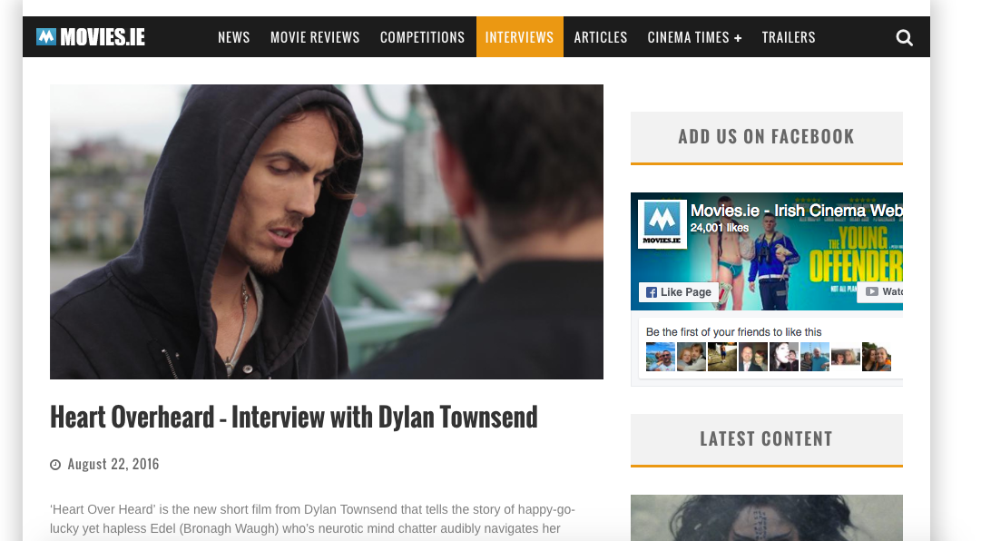 Dylan Townsend on Movies.ie with a hoodie looking down, being interviewed outdoors.