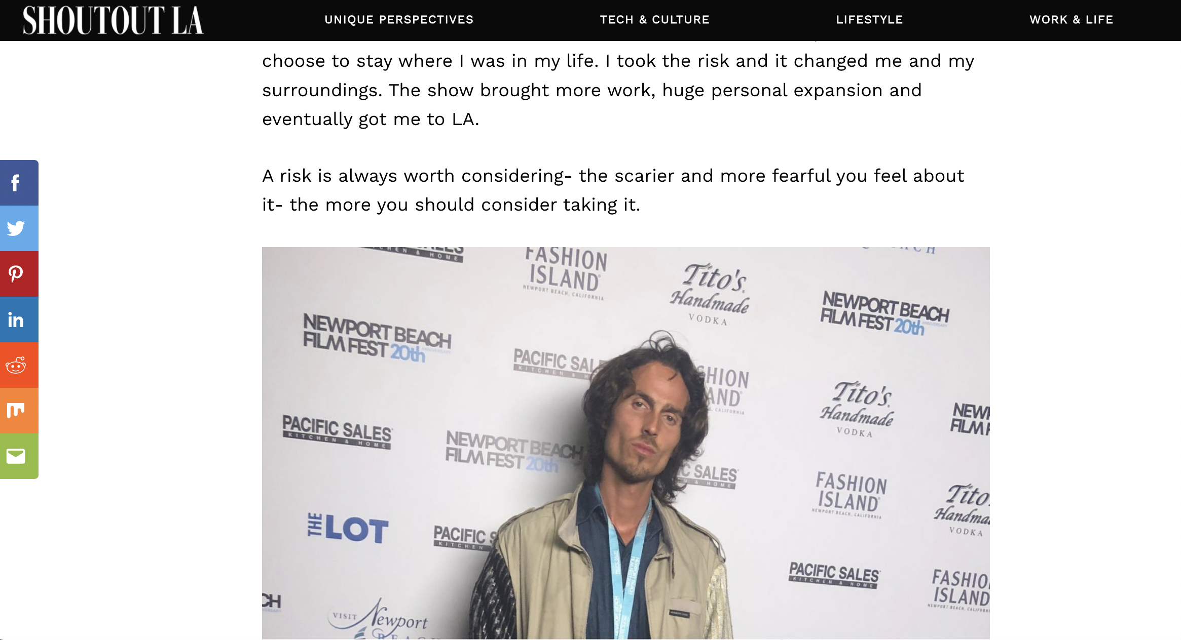 Dylan Townsend with long hair and a beard standing in front of a step and repeat backdrop featuring logos for Newport Beach Film Festival, Tito's Handmade Vodka, Pacific Sales, The Lot, and Fashion Island.