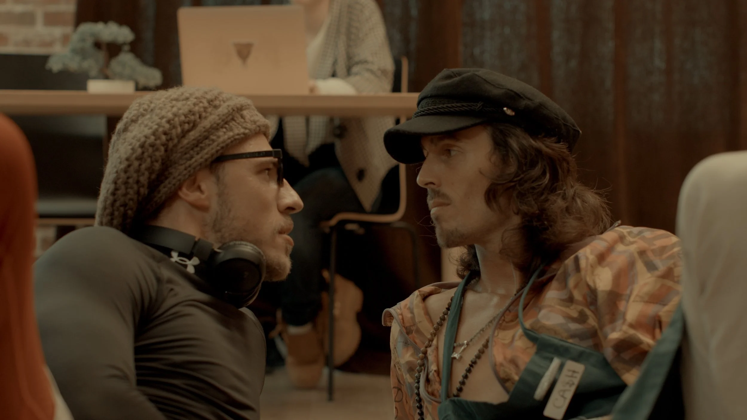  are face to face, leaning in close, appearing to be in a tense confrontation or intense conversation. Dylan Townsend still from tv show 'Under the Influence'.