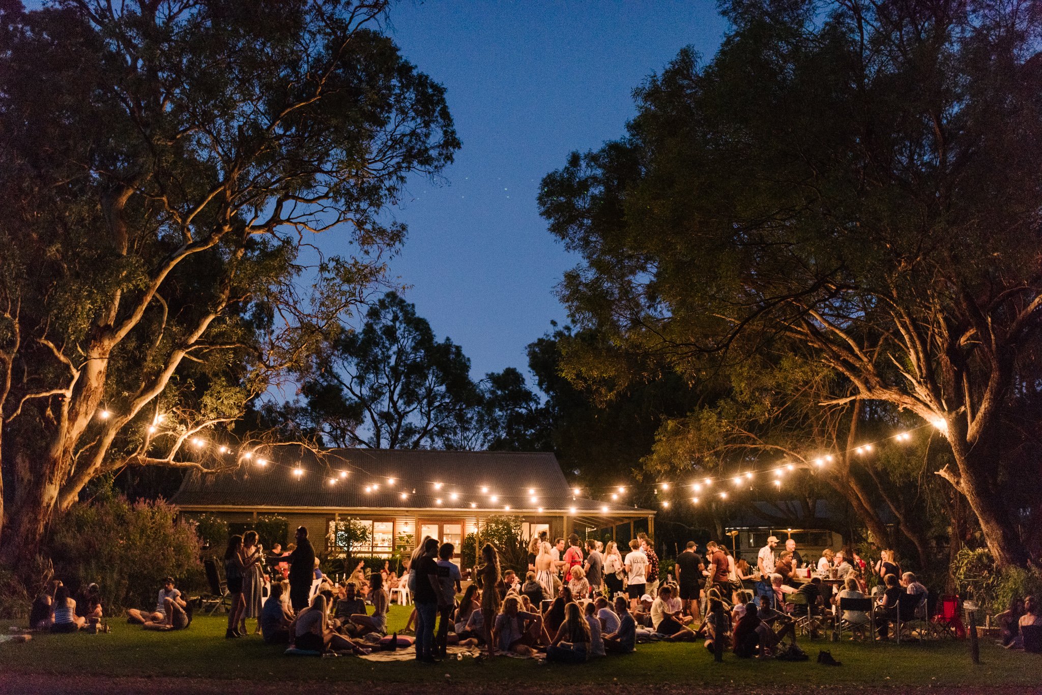 Crowd enjoying live music at Barossa Sessions during a warm spring evening in the Barossa Valley.