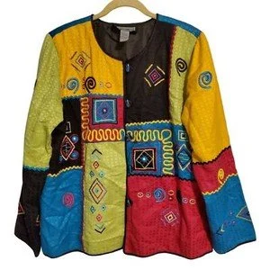 Colorful patchwork jacket with geometric patterns in yellow, blue, red, green, and black.