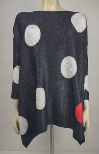 Black sweater with large white polka dots and one red polka dot, displayed on a mannequin.