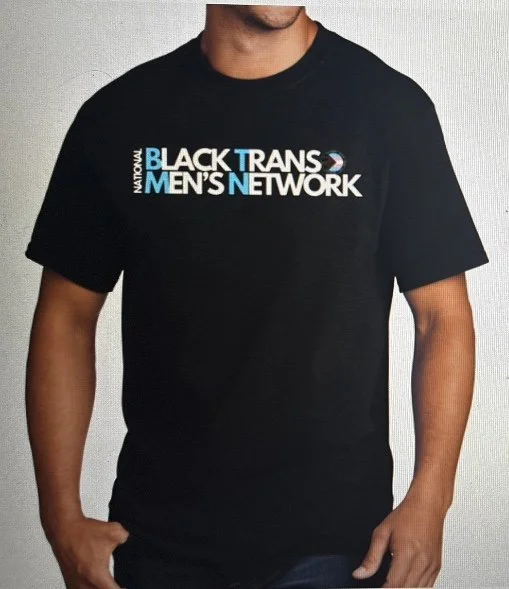 A person wearing a black T-shirt with the words 'National Black Trans Men's Network' printed in blue and white on the front.