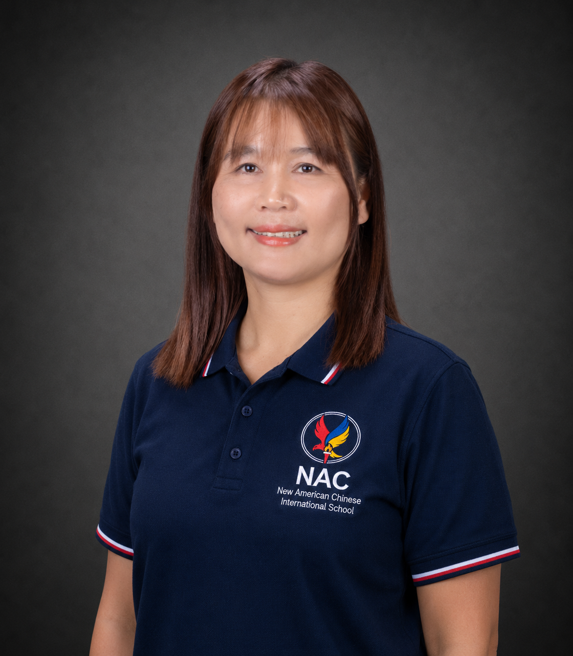 Portrait of a woman in a navy NAC school polo shirt