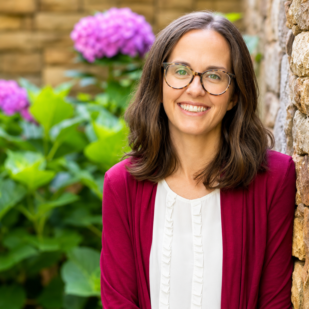 Diana Cleveland, Lactation consultant, glasses on her face, wearing and magenta sweater