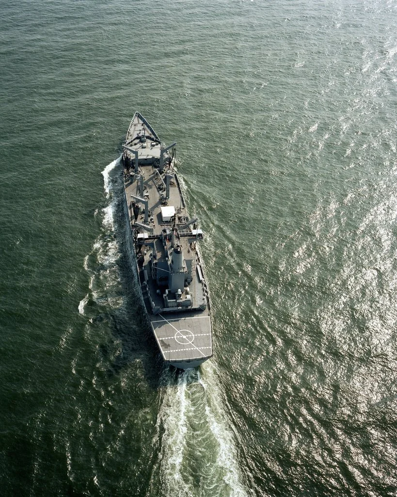 USS PLATTE viewed from above, underway.