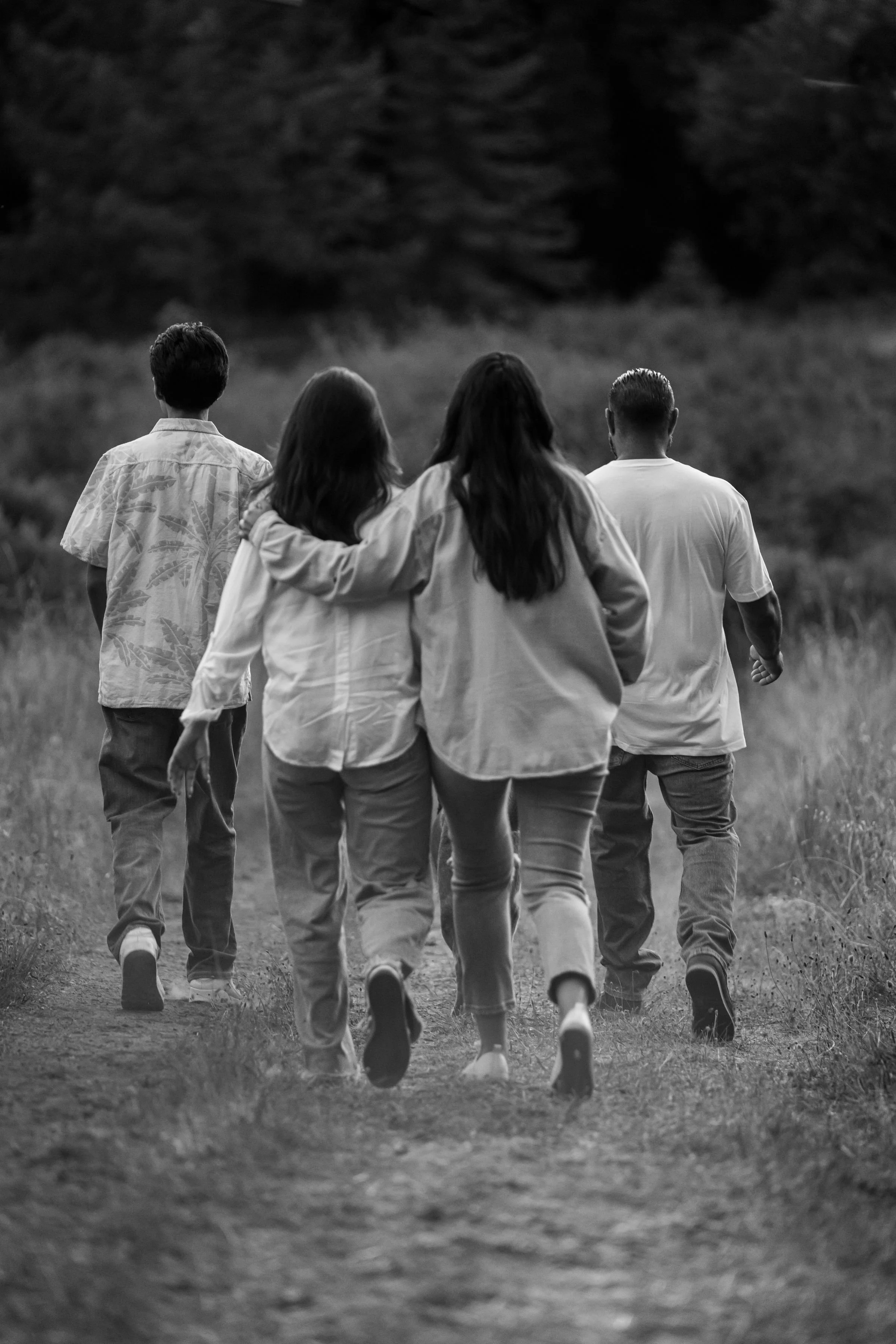Adults walking together outdoors, representing connection and emotional wellness