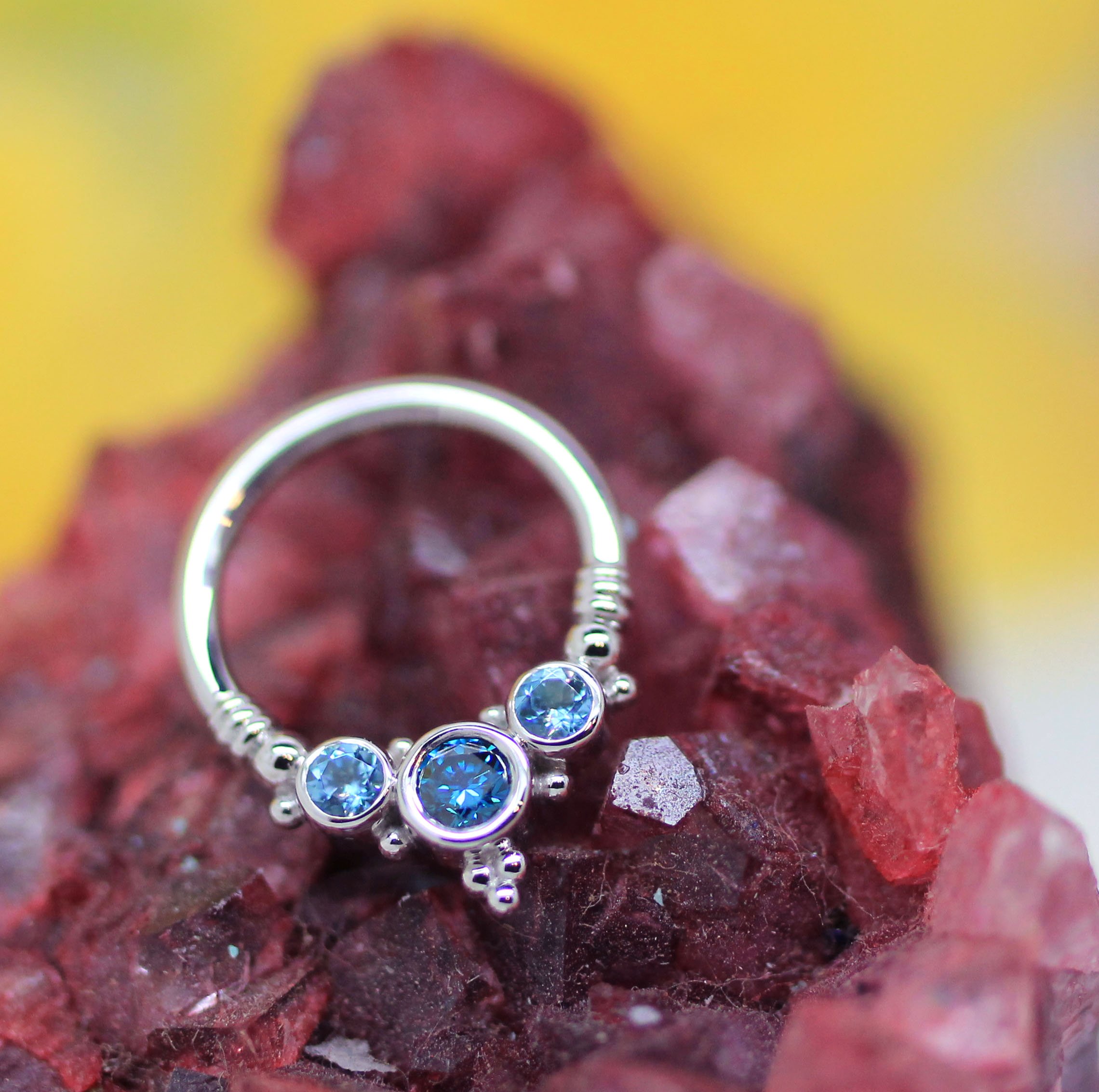 the-crows-nest-tattoo-jewelry-gold-dubuque-blue-gemstones-piercing.jpg