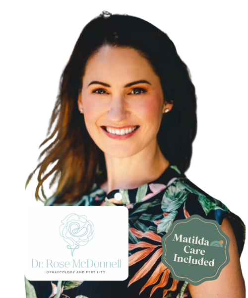 Smiling woman with long brown hair wearing a colorful tropical print top, showcasing her face and shoulders, with a logo for Dr. Rose McDonnell, Gynaecology and Fertility, and a badge indicating Matilda Care is included.