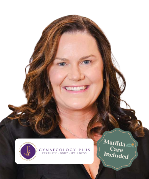A woman with wavy brown hair smiling, wearing a black top, with logos for Gynecology Plus and Matilda Care Included next to her.
