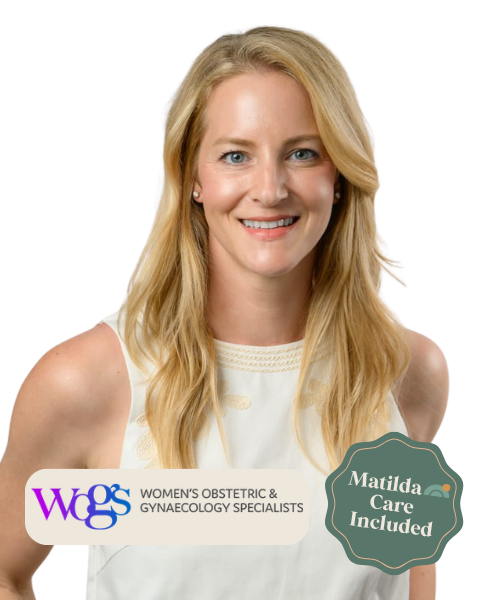 A woman with long blonde hair, smiling, wearing a sleeveless white top, standing against a black background with a logo and text related to women's obstetric and gynecological specialists, and a badge indicating care included.