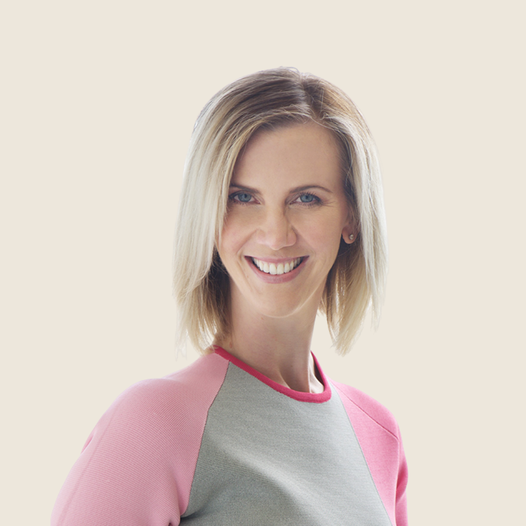 Headshot of doctor Jade Acton, a blonde woman in a pink and gray shirt.
