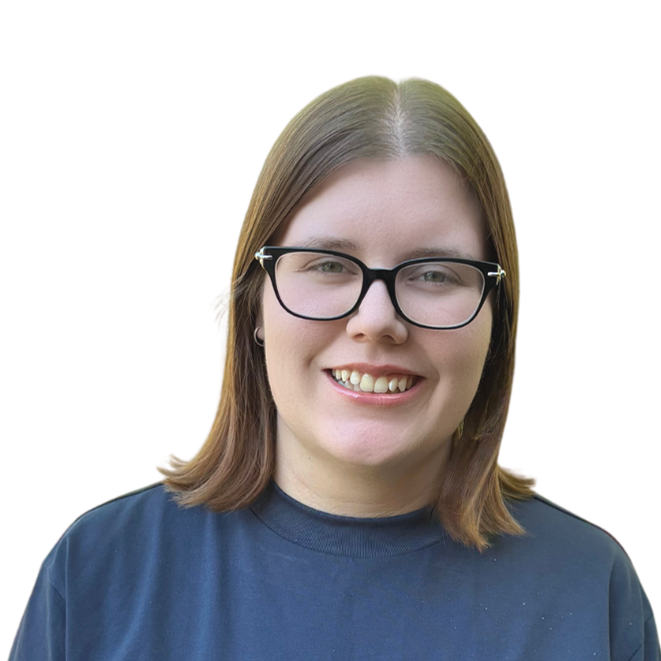 A woman with brown hair, blue eyes, and a septum piercing, smiling, wearing a black-colored shirt, against a plain background.